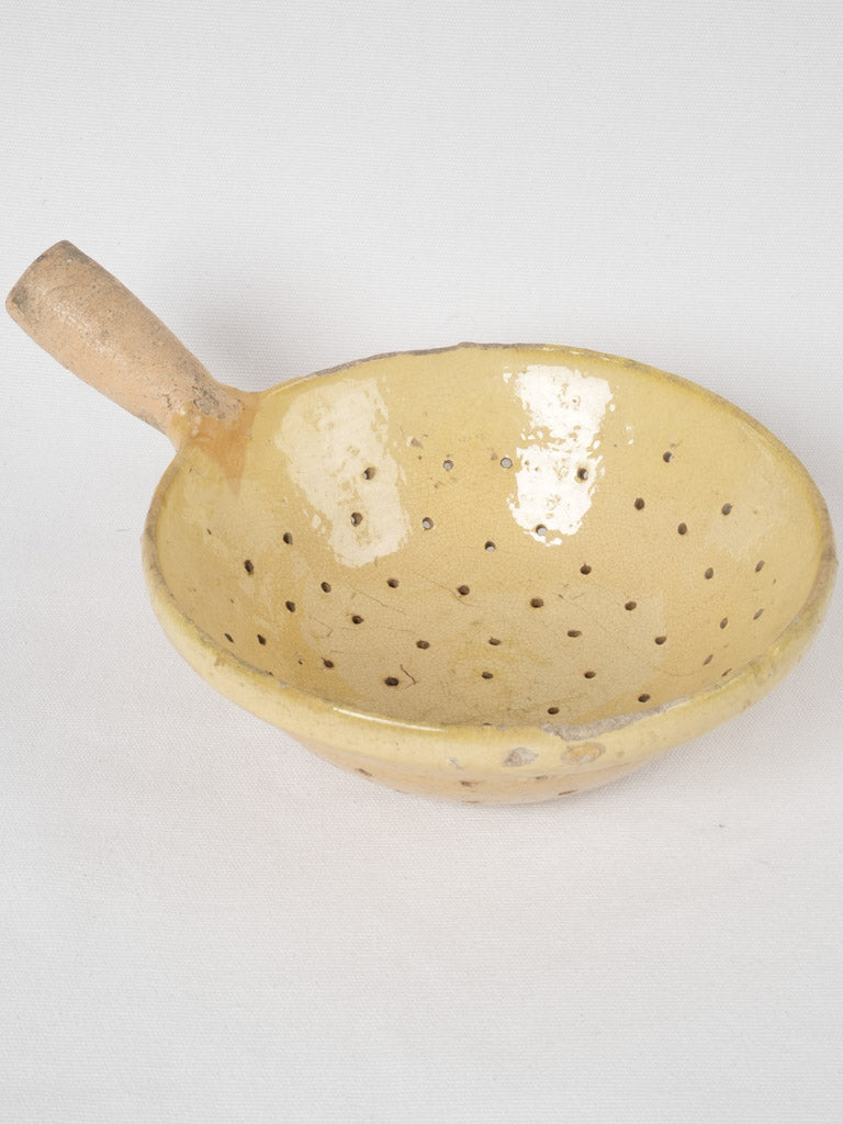 Deep, glazed terracotta vegetable strainer