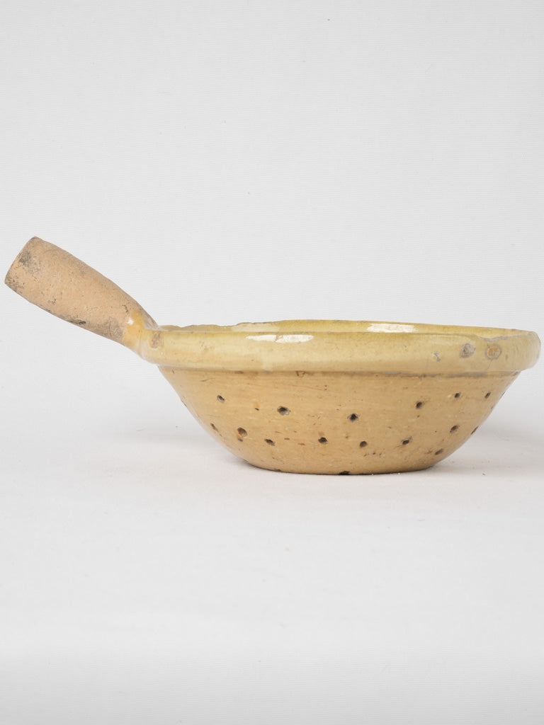 Glazed terracotta vegetable and pasta strainer