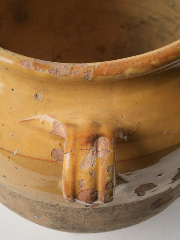 Curved handle confit pottery