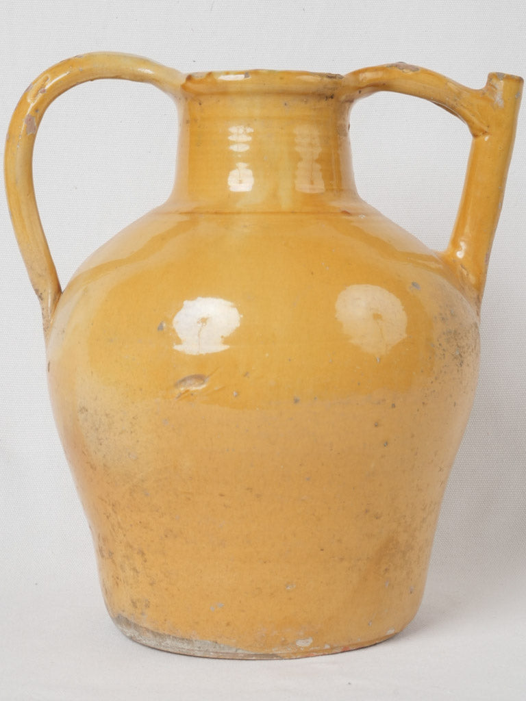 Aged ocher and green water pitcher