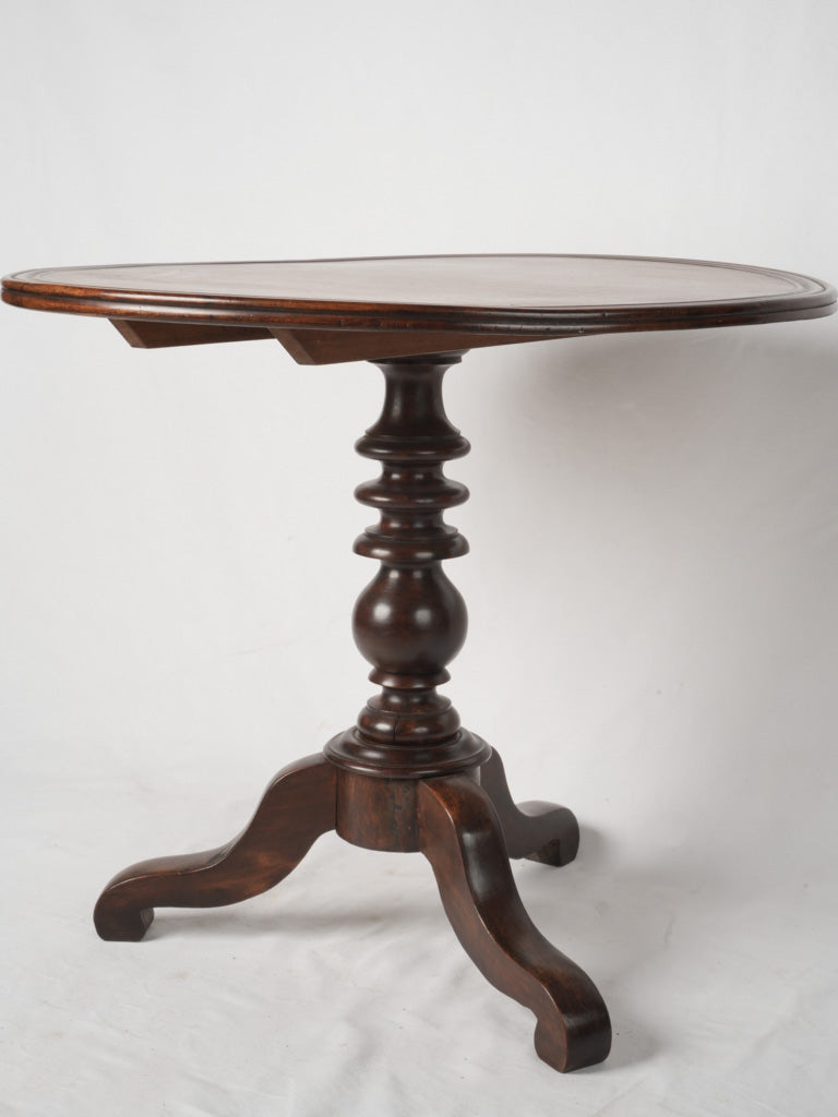 Sculptural carved feet bistro table