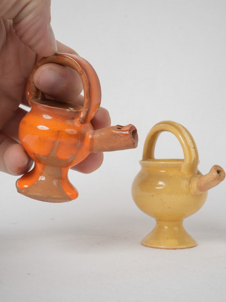 Antique orange and yellow terracotta bird whistles