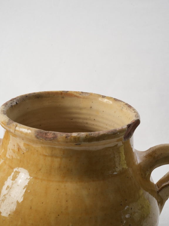 Rustic yellow glazed earthenware pot  