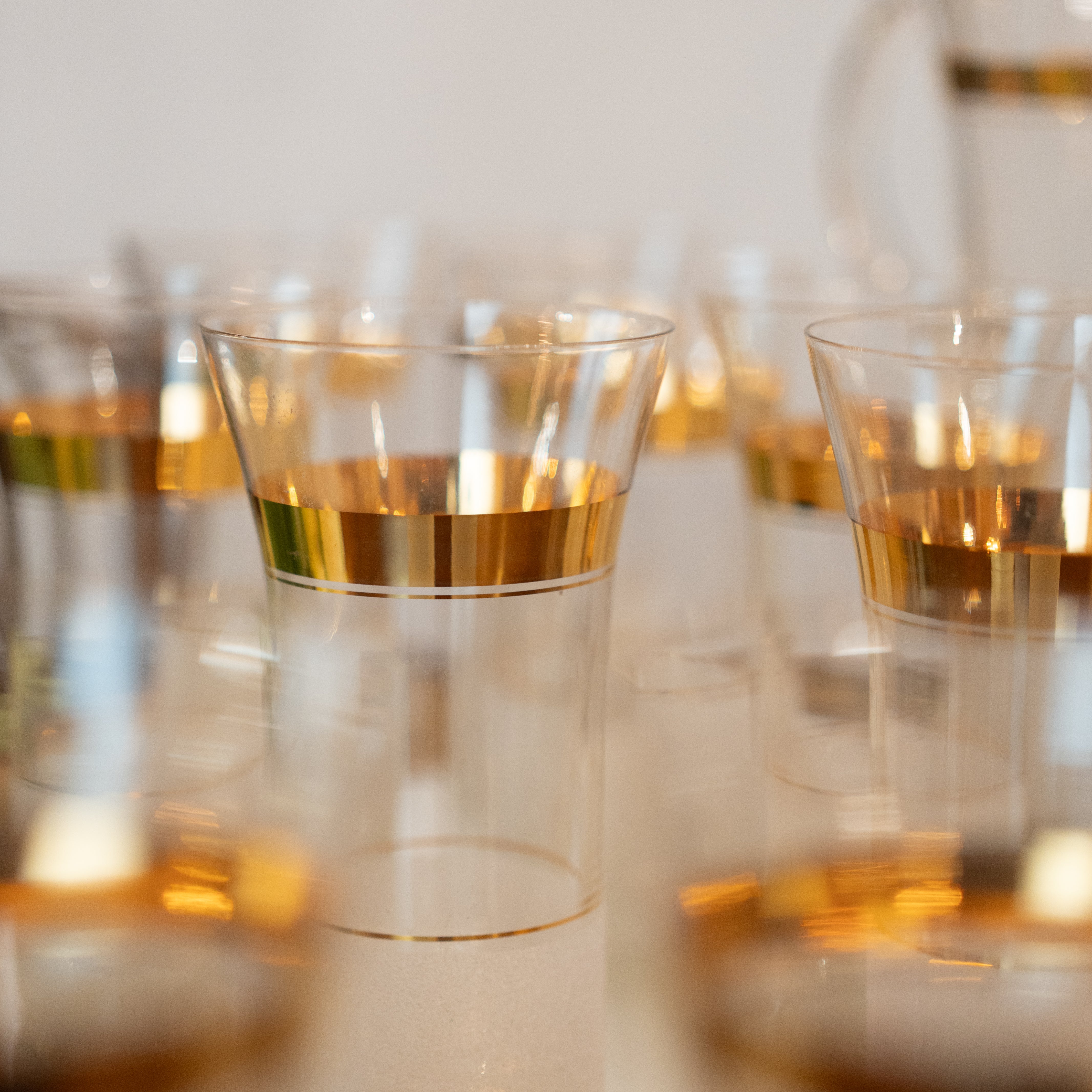 Exquisite gold-rimmed pastis stemware