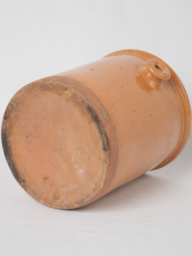 A time-worn ear-handle pot