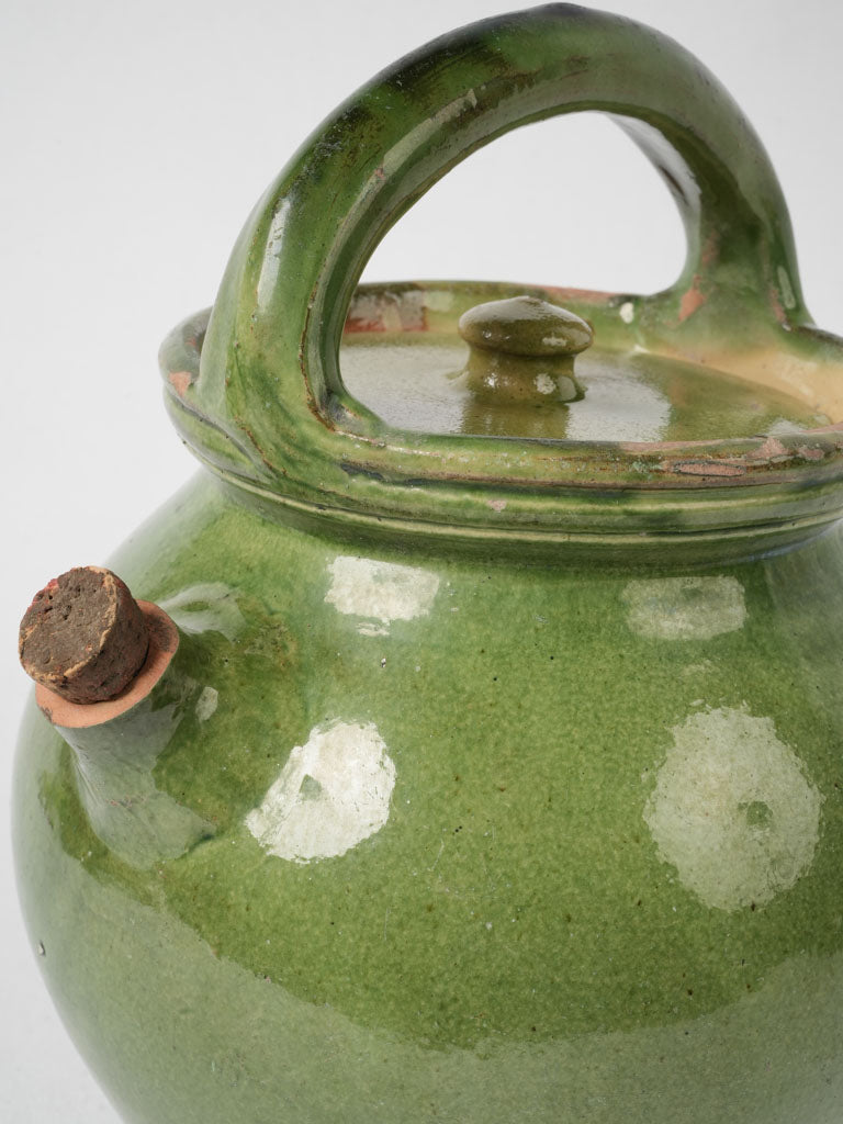 Aged green ceramic lidded pitcher