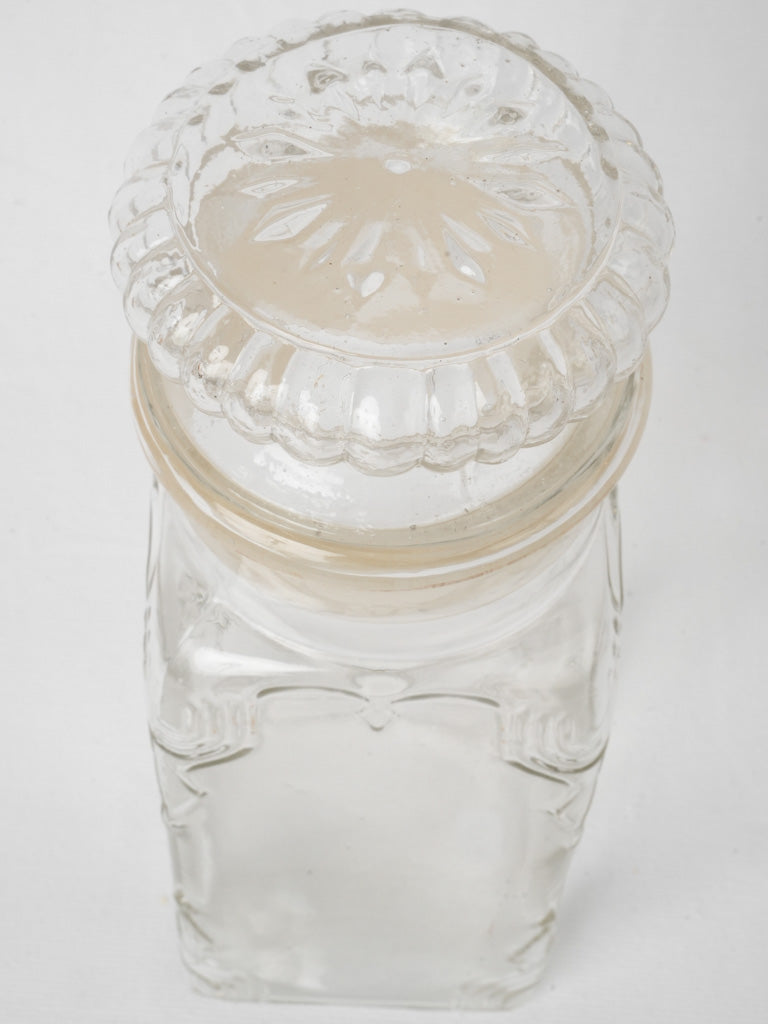 Intricate transparent glass storage jar