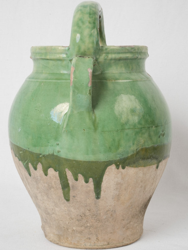 Aged green pottery water pitcher