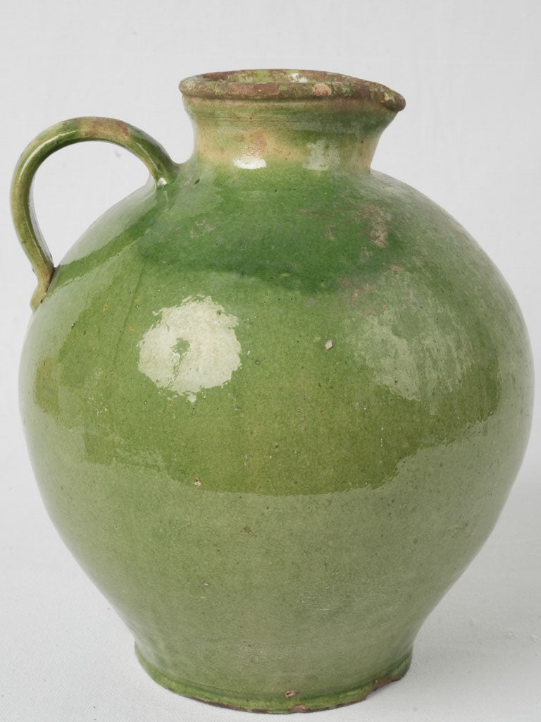 Elegant rounded green-glazed vessel  