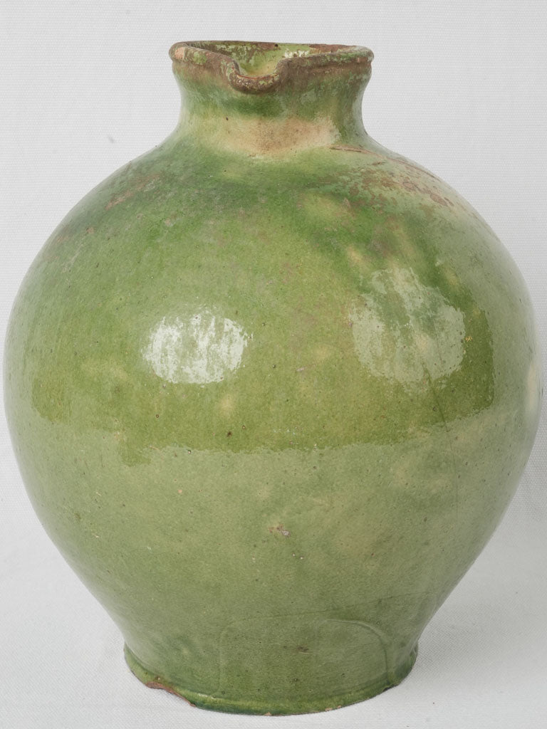 Artisanal aged green-glazed ewer  