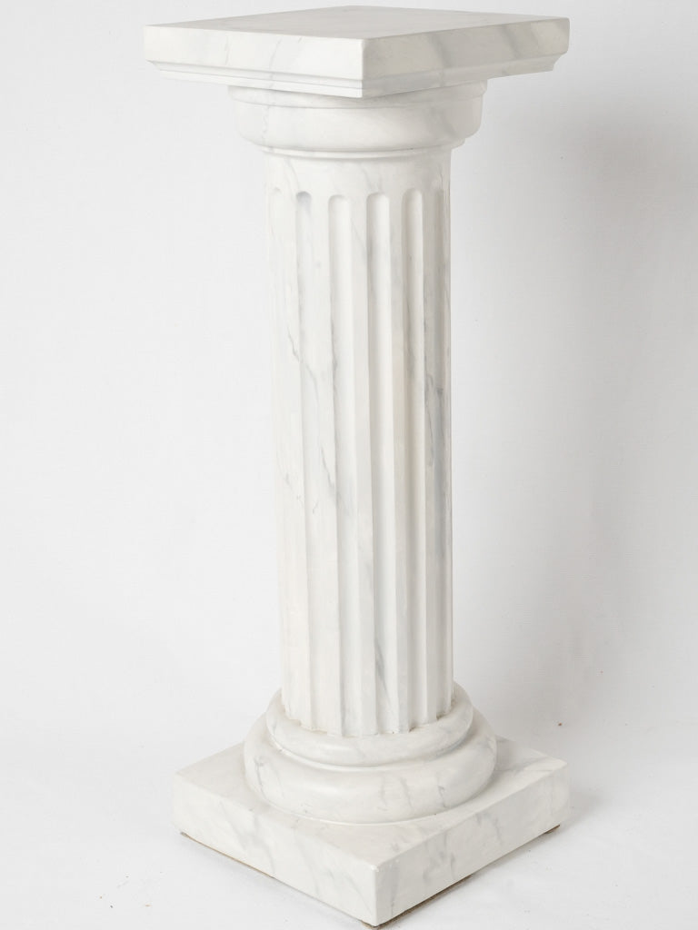 Aged marble-style square pedestal