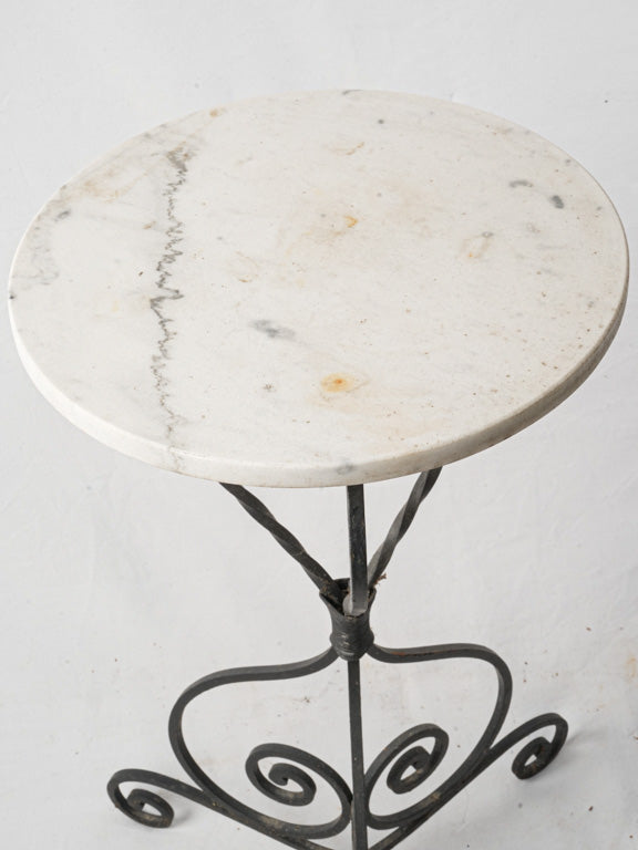 Airy French wrought iron table