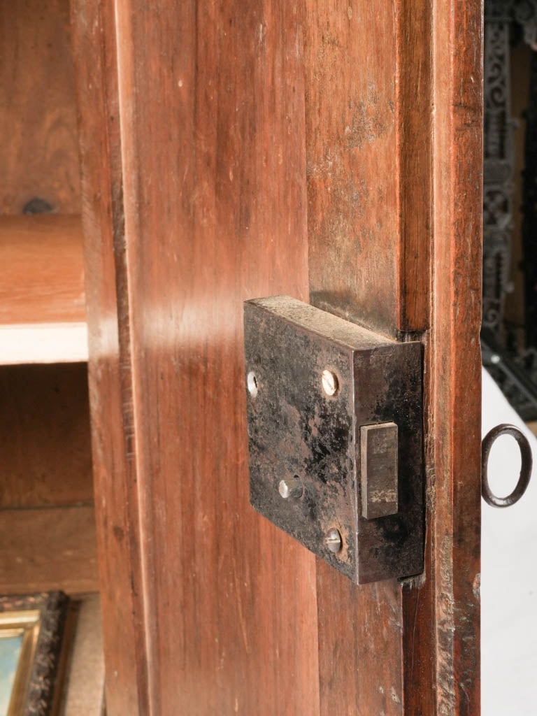 Empire-era walnut cabinet with antique key