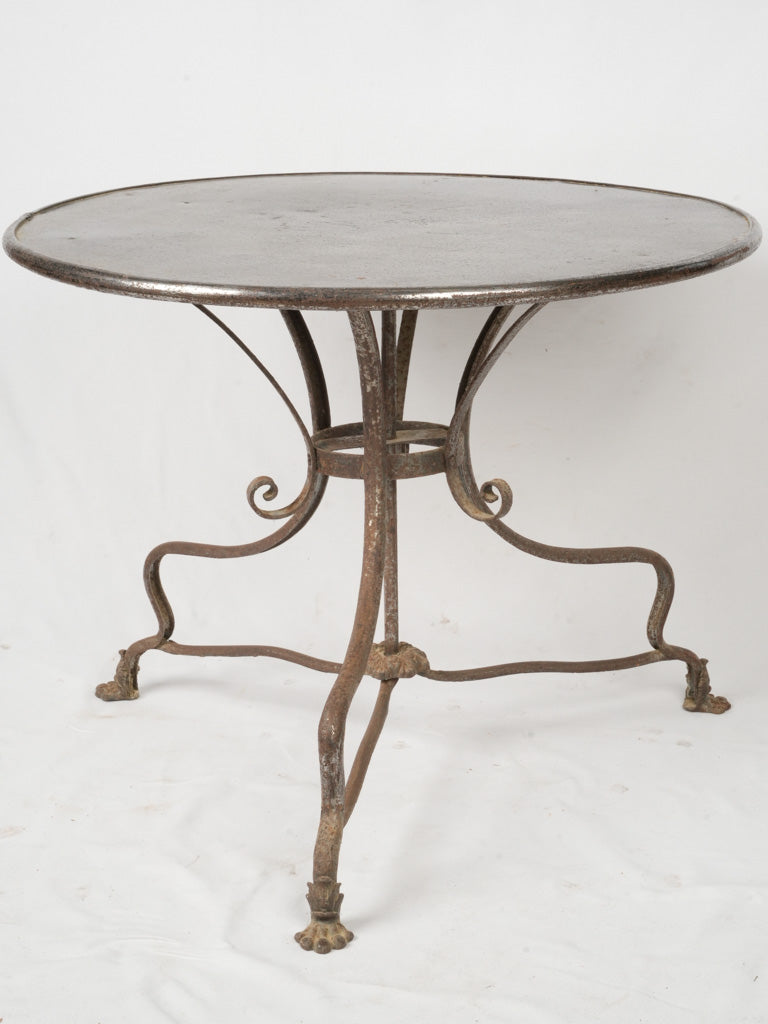 Antique ornate wrought iron garden table