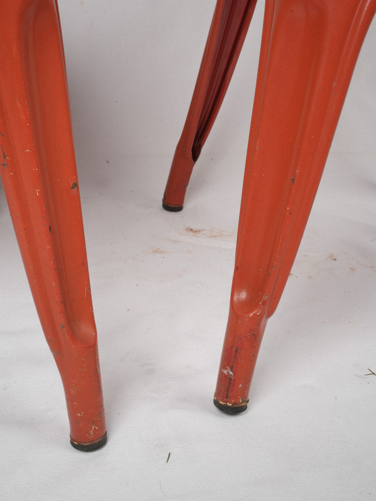 Iconic mid-century red metal chairs