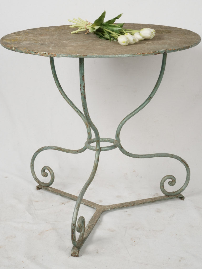 Aged green-blue patina garden table