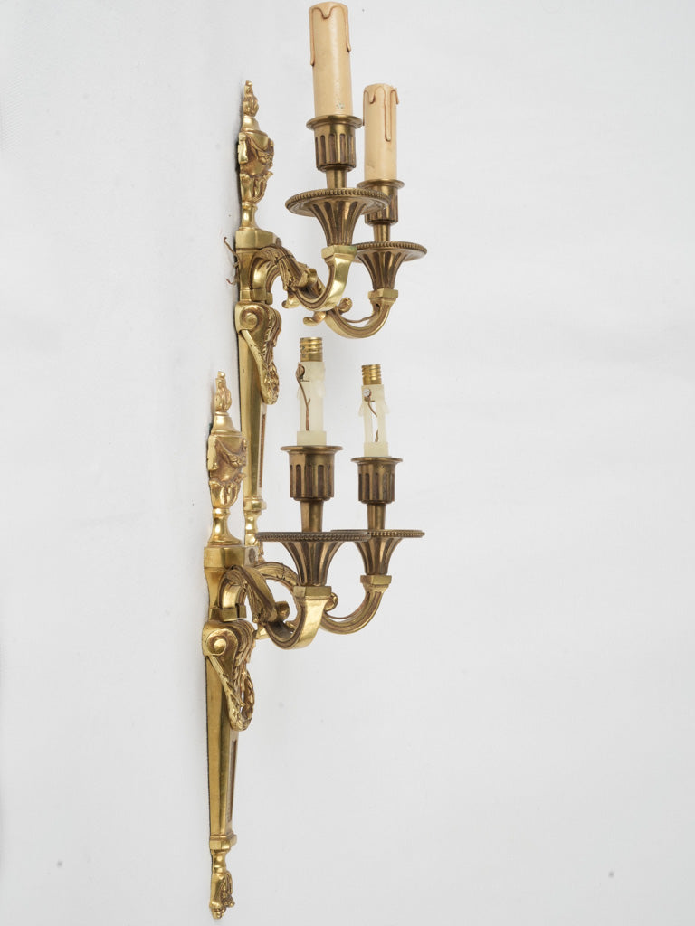 Lavish, antique, two-light gilded sconces