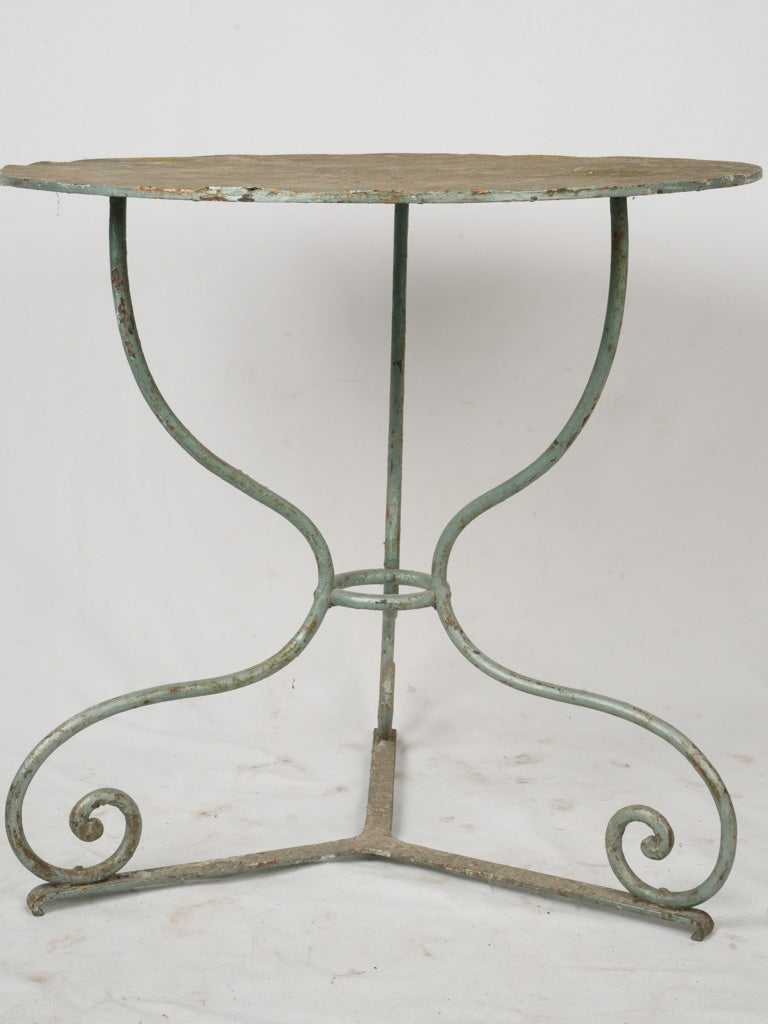 Weathered outdoor wrought iron table