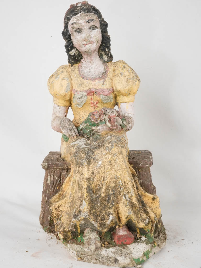 Vintage yellow-dress garden sculpture