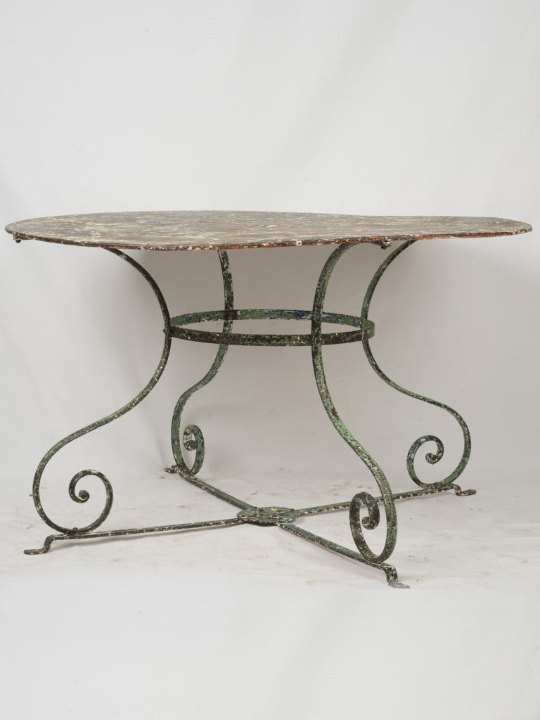 Graceful antique outdoor gathering table