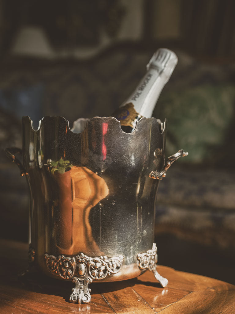 Silver plate, vine-detailed ice bucket