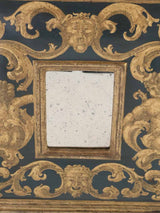 Cherub-adorned gilded Venetian mirror