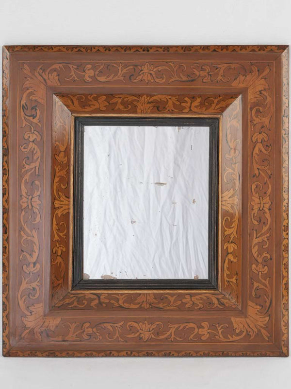 Ornate 17th-century marquetry mirror