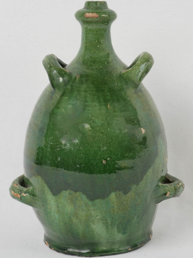 Antique emerald green glazed conscience jug