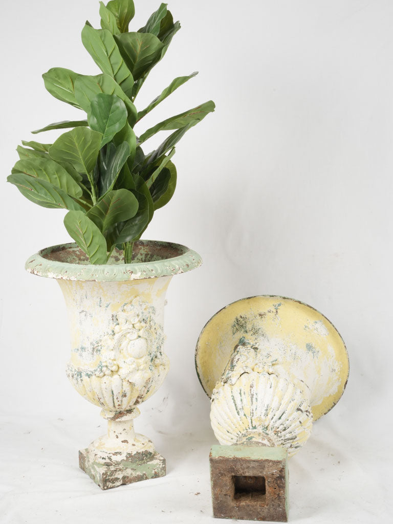 Exquisite patinated white cast-iron urns