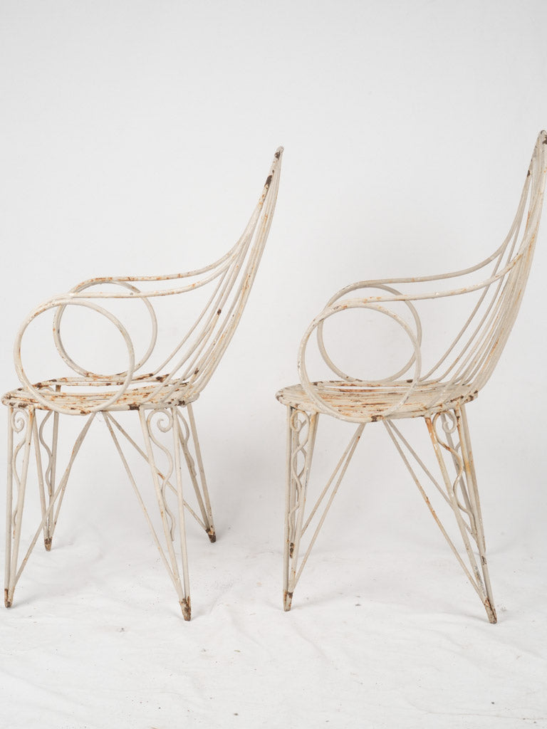 Elegant French garden chairs with swirling arms