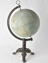 Antique world globe with major repairs