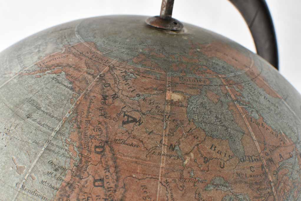 Napoleon styled world globe, cast iron base