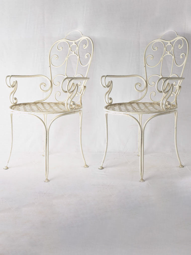 Pair antique French wrought iron garden armchairs w/ white patina