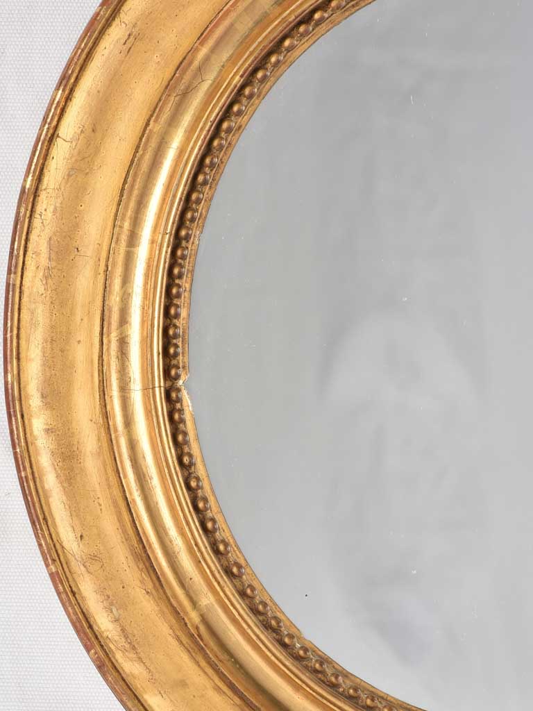 Small oval mirror w/ gilded frame & beading 17¾" x 15¾"