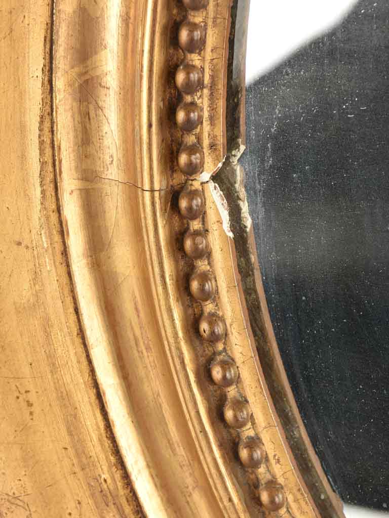 Small oval mirror w/ gilded frame & beading 17¾" x 15¾"