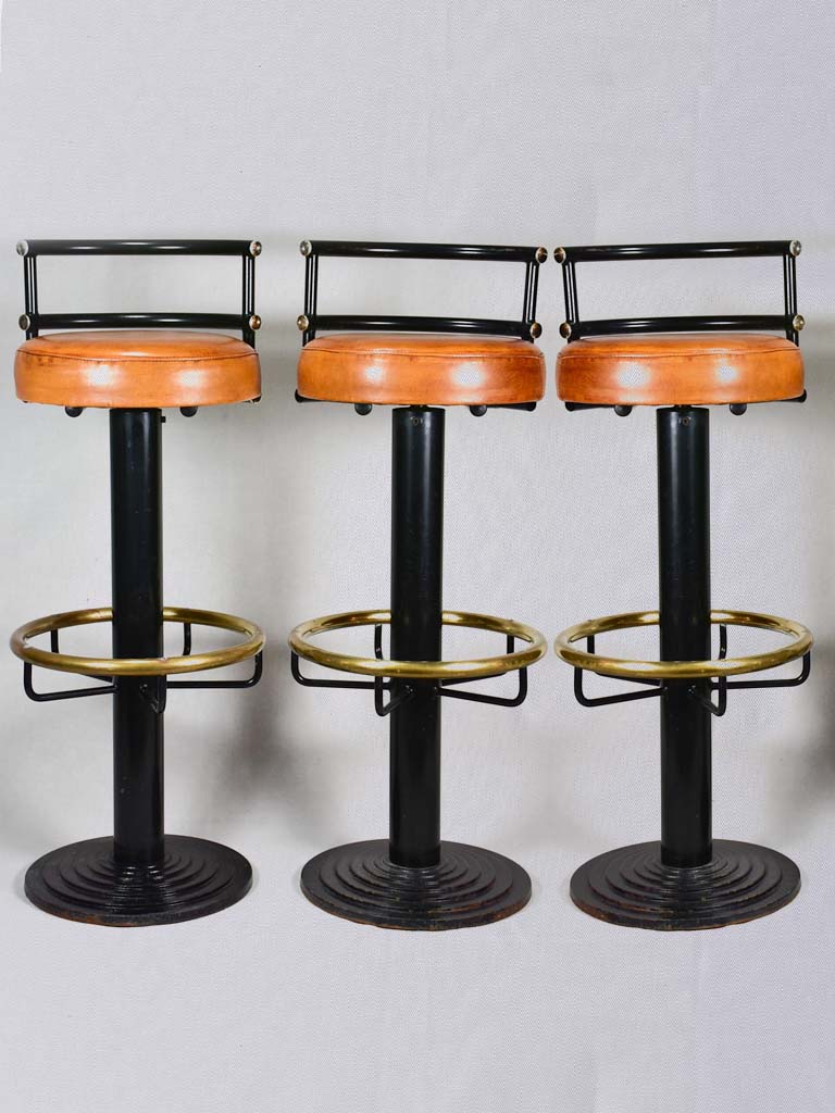 Three 1960s French leather barstools