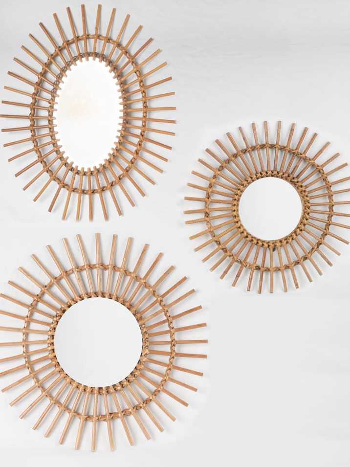 Three vintage sunburst mirrors w/ wicker frames