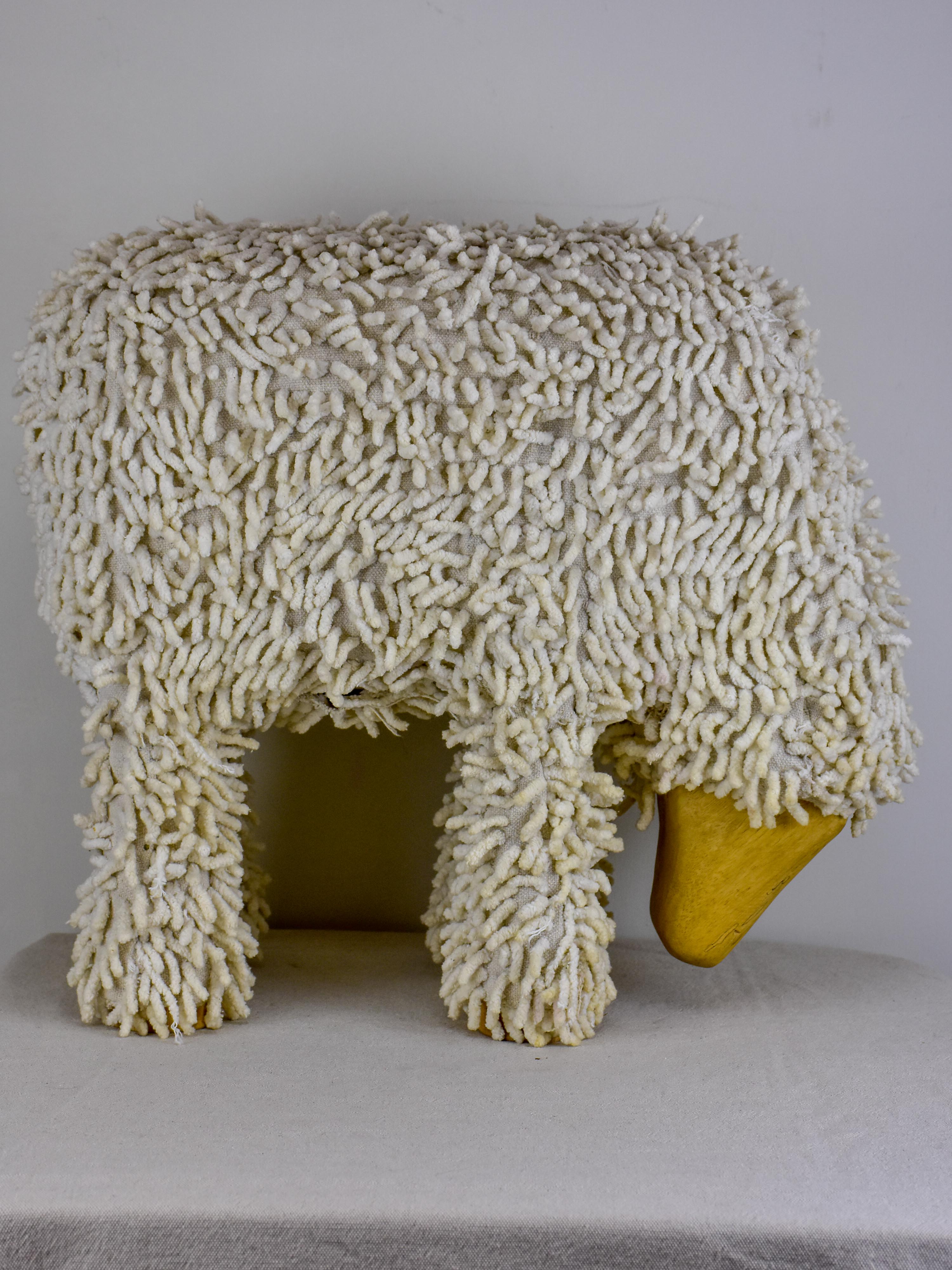 Vintage sculpture of a grazing sheep