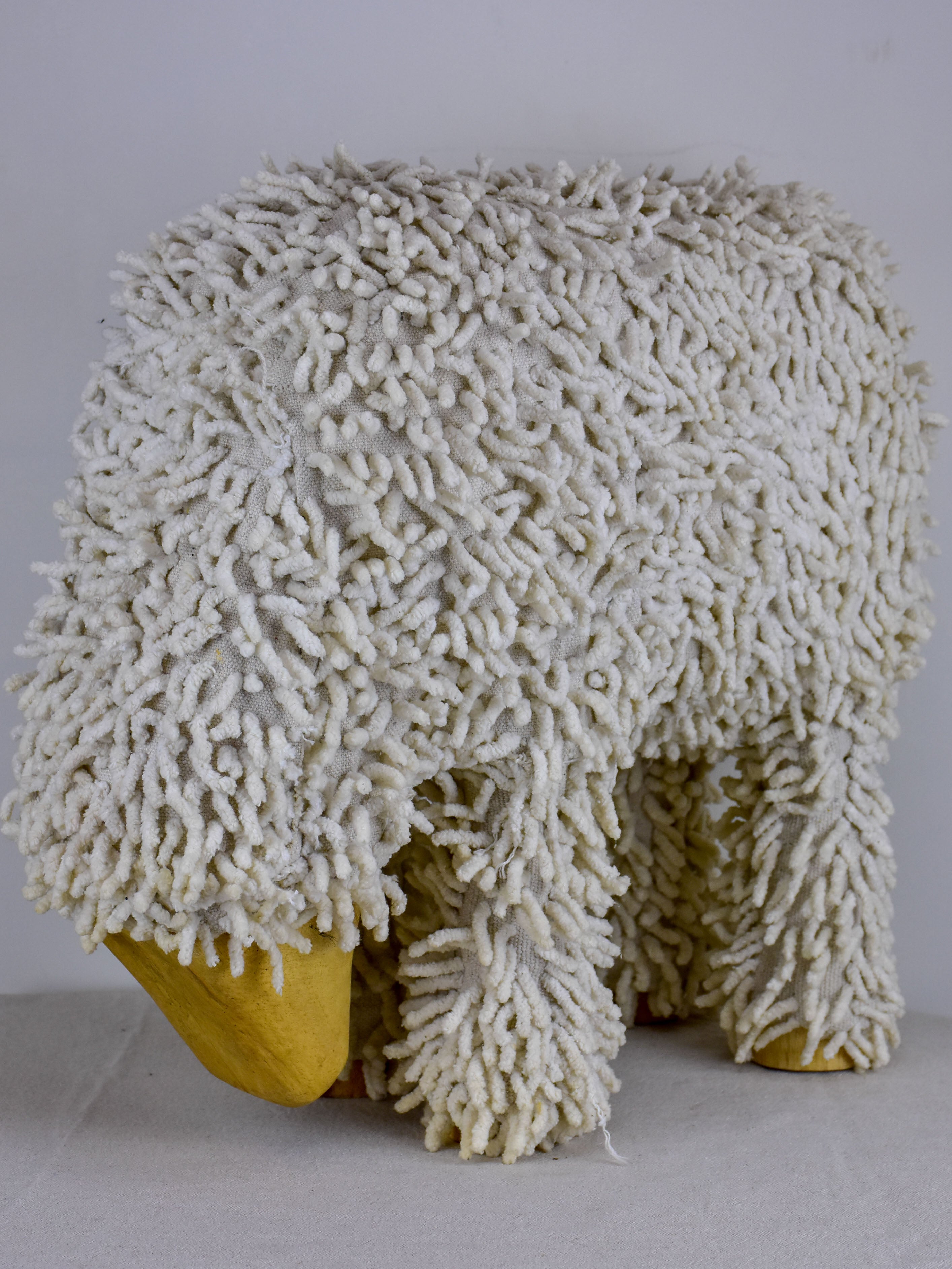 Vintage sculpture of a grazing sheep