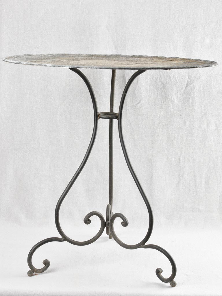 Antique French garden table with wrought iron base