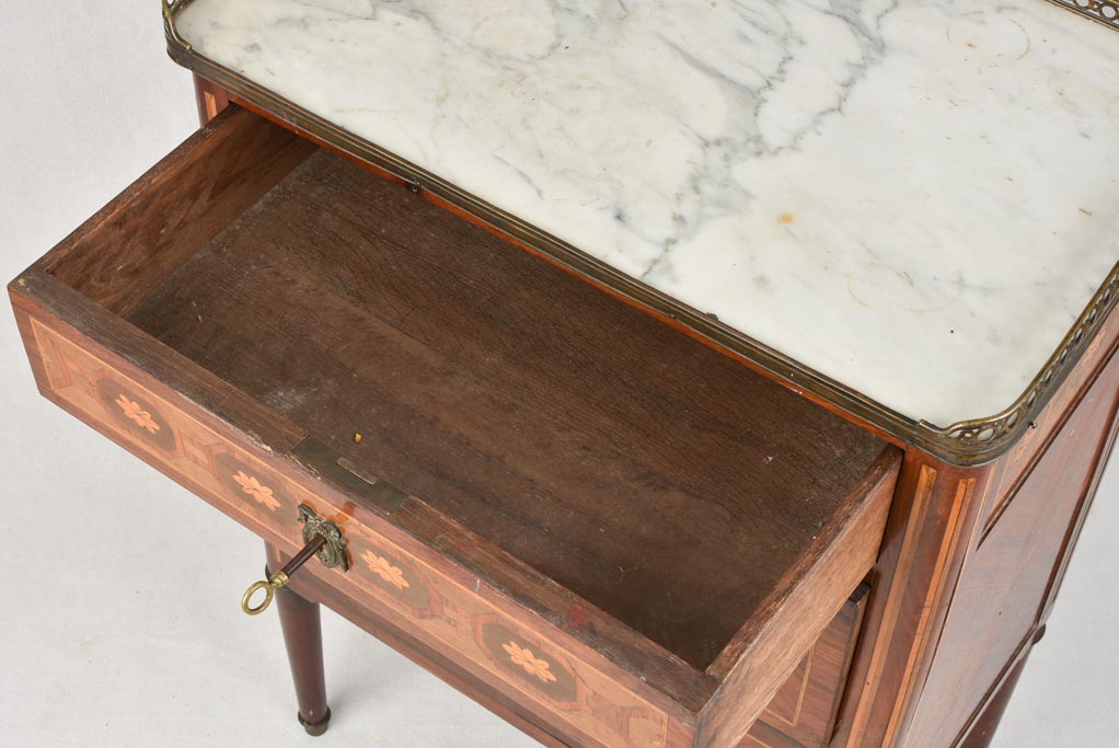 Sophisticated brass-galleried Louis XVI nightstand