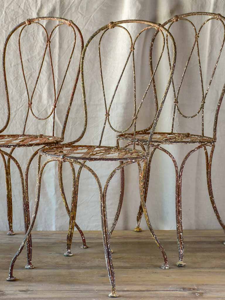 Three antique French iron garden chairs