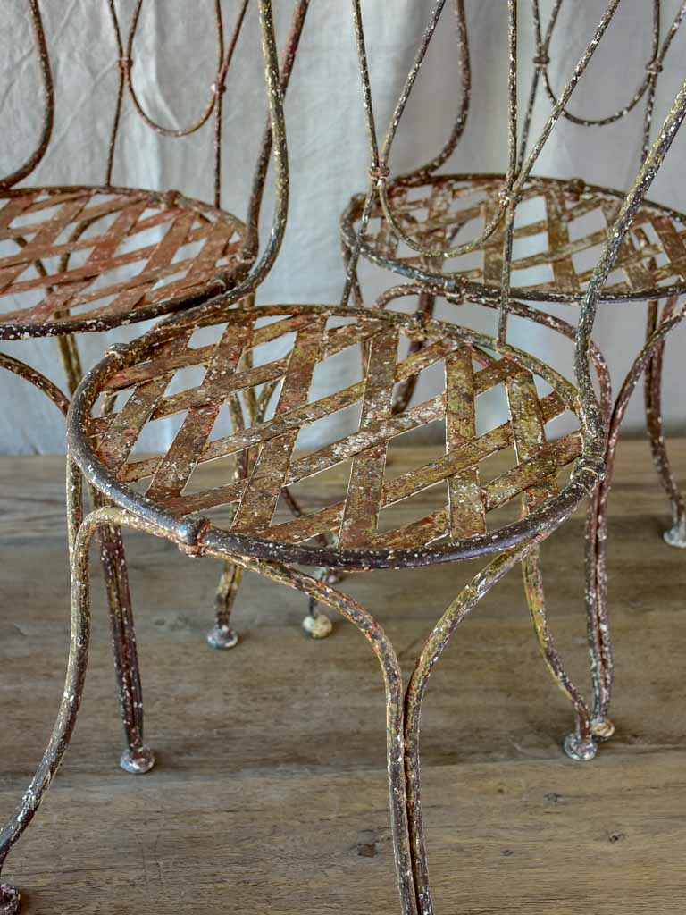 Three antique French iron garden chairs