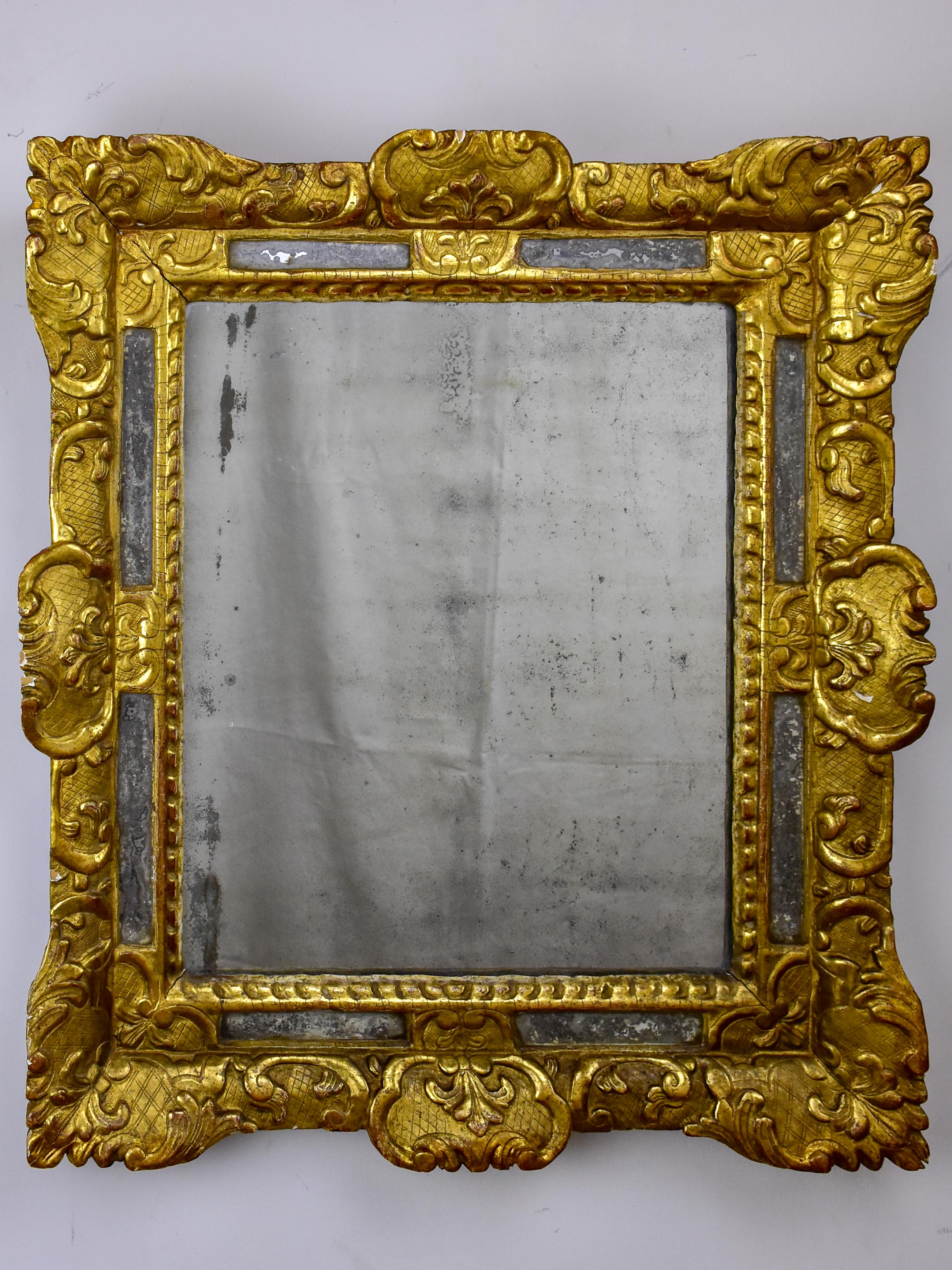 18th Century French mirror with gilded frame and aged glass 26” x 22 ½''