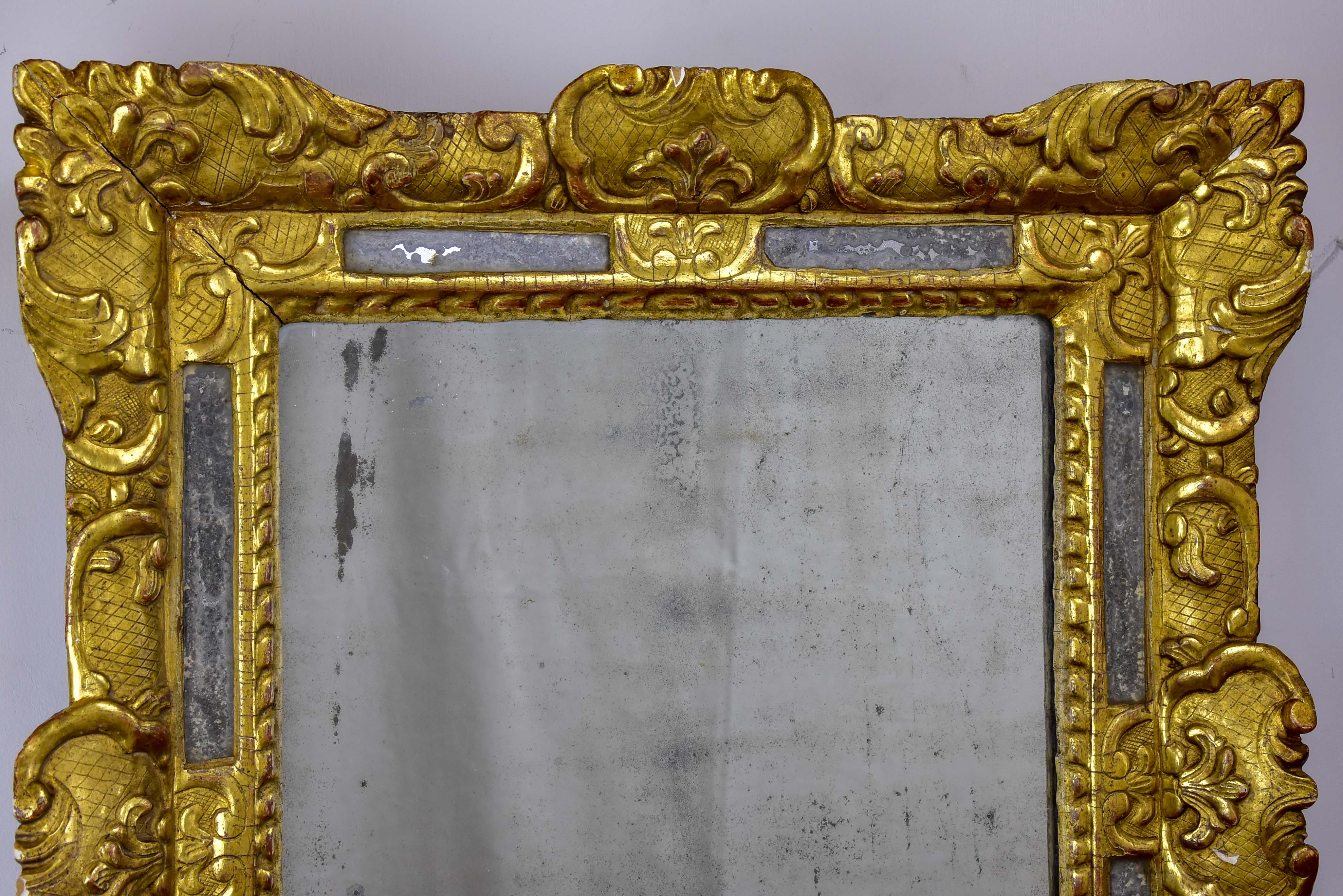 18th Century French mirror with gilded frame and aged glass 26” x 22 ½''