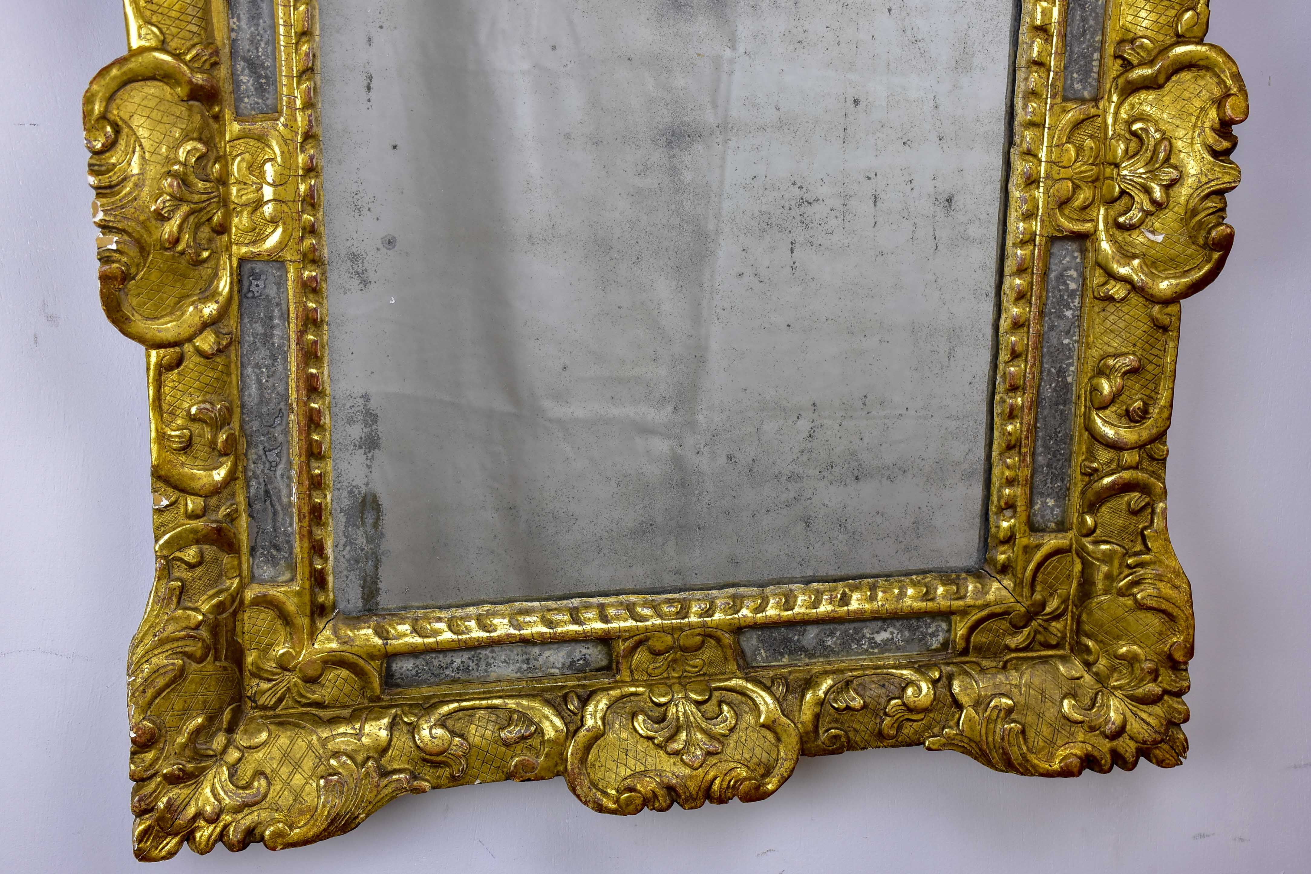 18th Century French mirror with gilded frame and aged glass 26” x 22 ½''