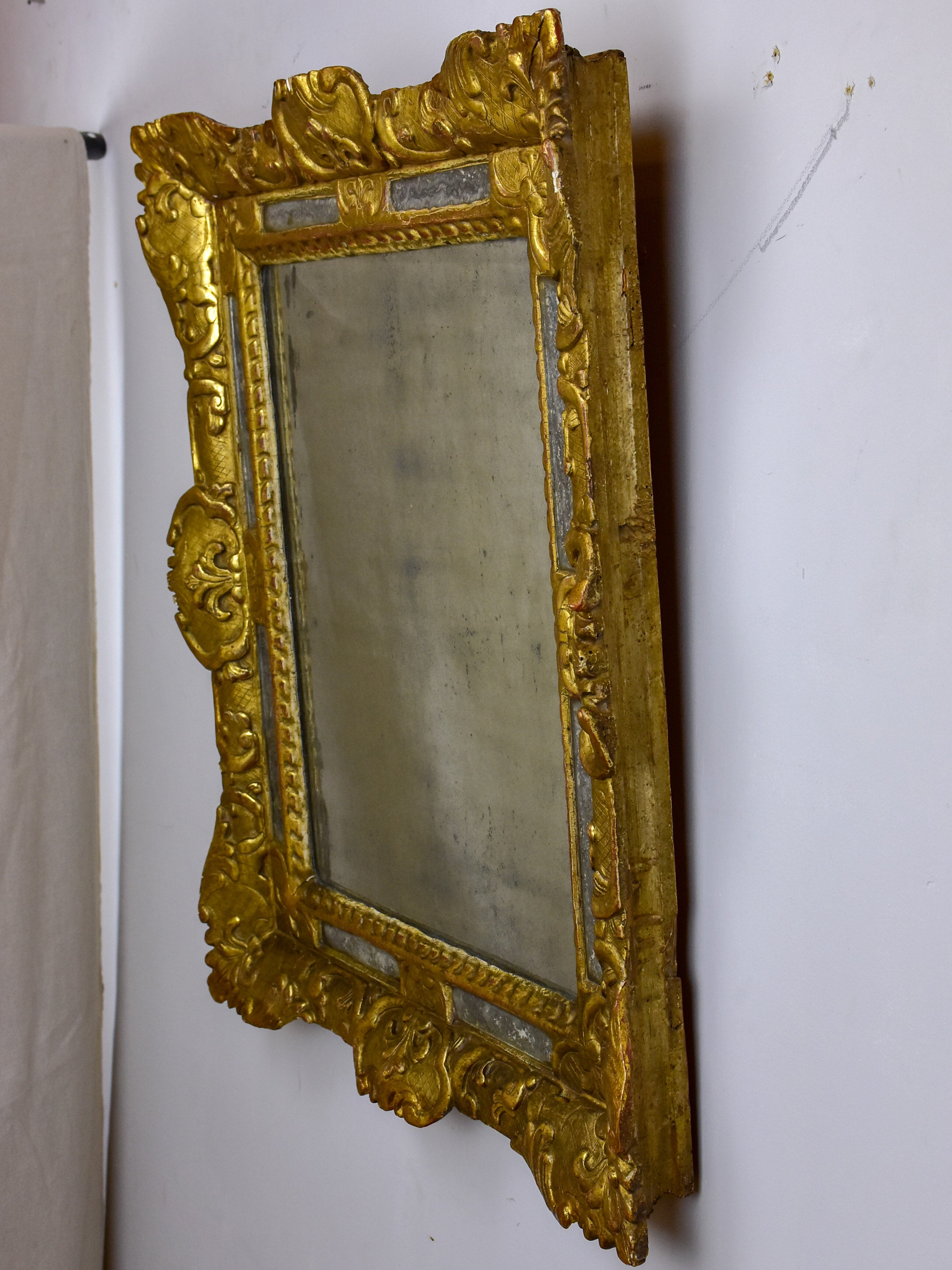 18th Century French mirror with gilded frame and aged glass 26” x 22 ½''