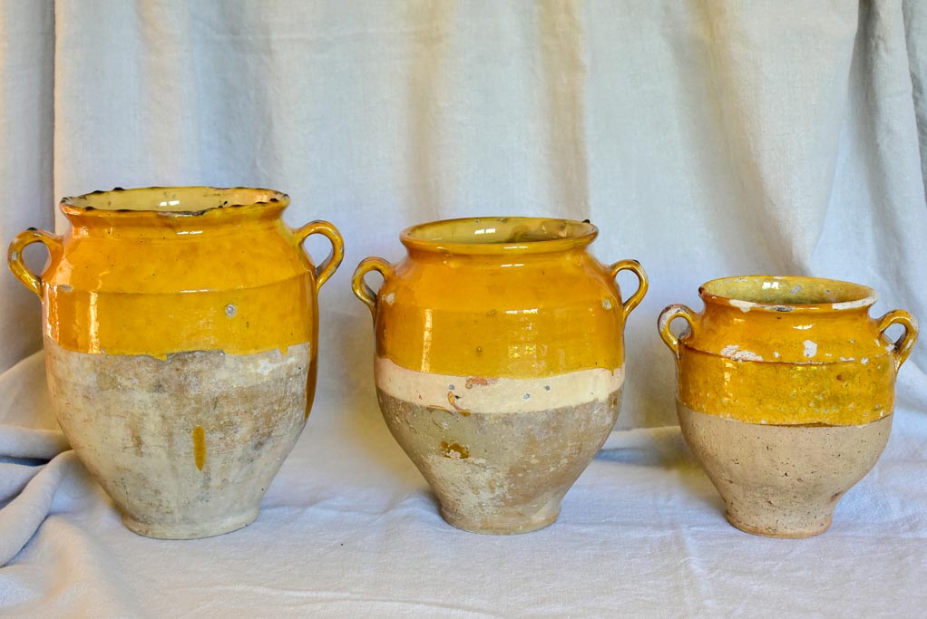 Collection of three antique French confit pots with ochre glaze