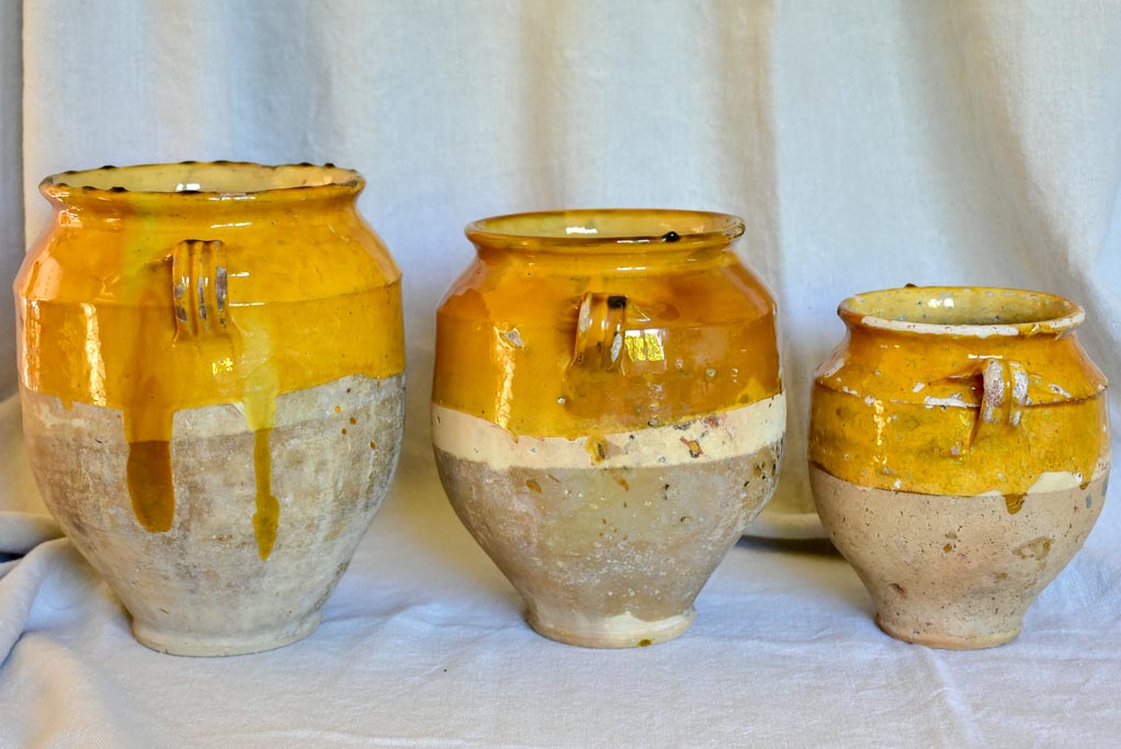 Collection of three antique French confit pots with ochre glaze