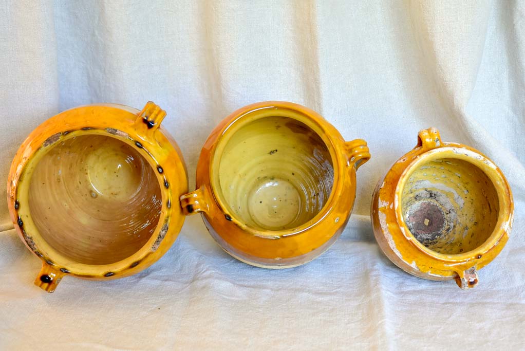 Collection of three antique French confit pots with ochre glaze